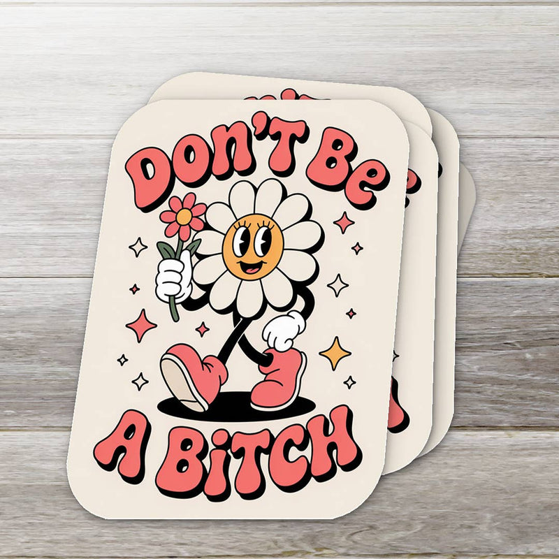 Card with cartoon character holding a flower and text 'Don't Be A Bitch' on a wooden surface