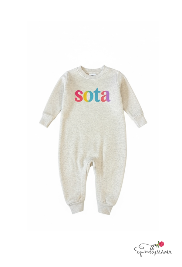 Oatmeal  sweatshirt jumpsuit for babies or toddlers with 'sota' printed on it against a white background