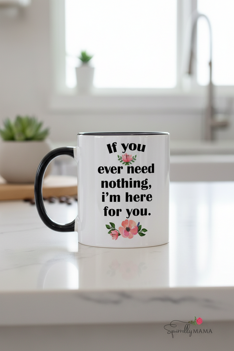 White mug with black handle featuring motivational quote and floral designs on a white background