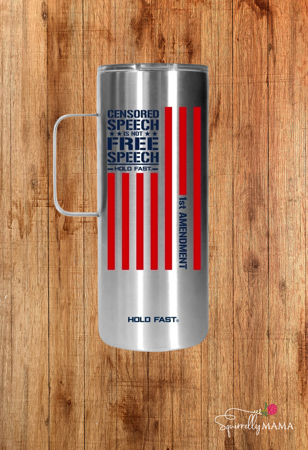 Silver mug with patriotic text and flag design on a wooden surface