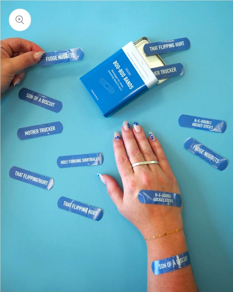 Blue band-aid packaging with various funny text designs on a blue background.